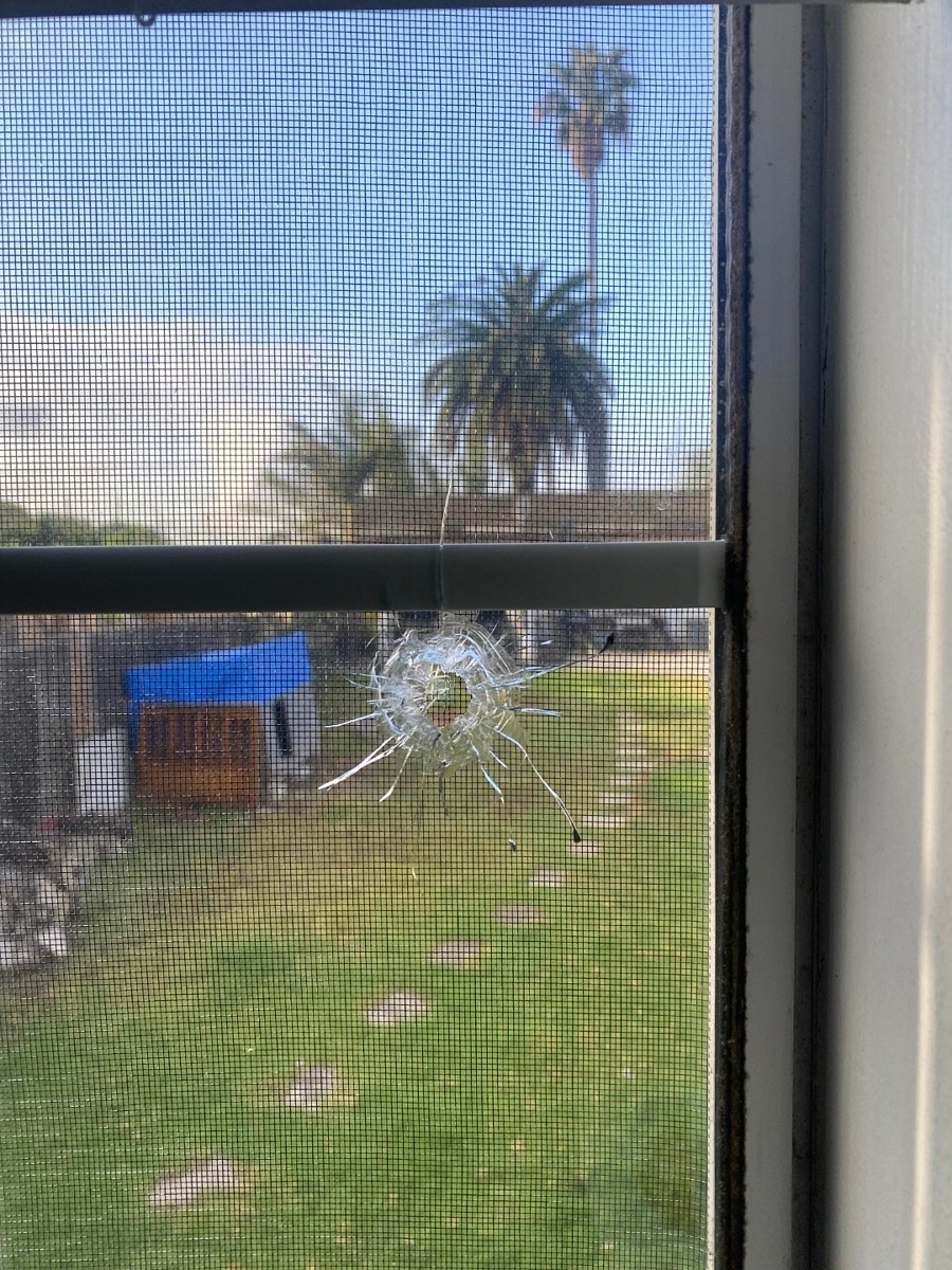 Window with bullet hole
