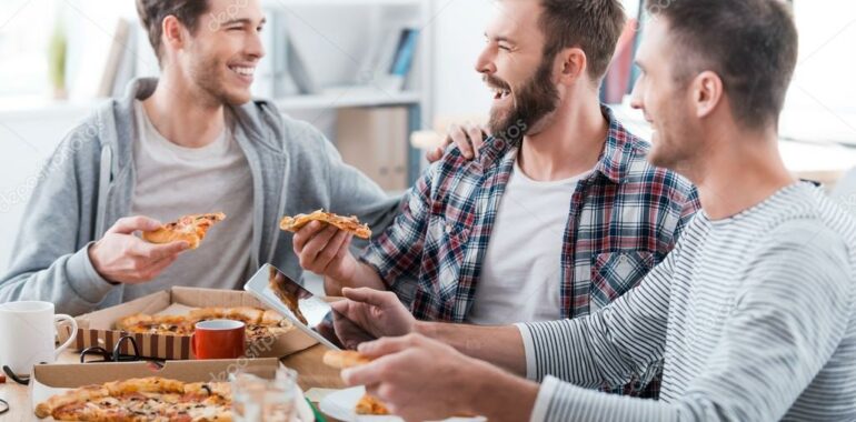 depositphotos 73022253 stock photo young men eating pizza in